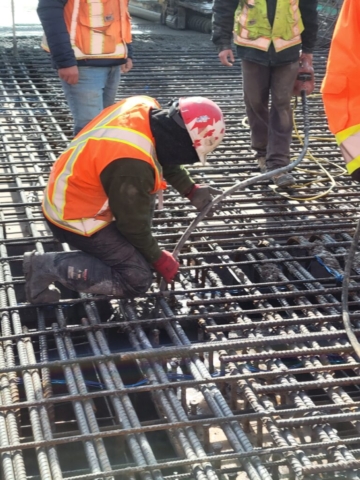 Vibrating the concrete at the pier 11 diaphragm