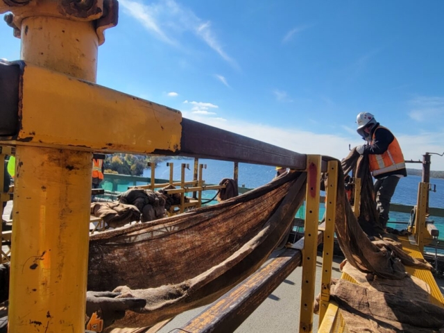 Work bridge, placing wet burlap on the newly placed concrete