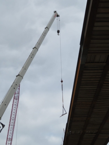 Lifting the support brackets to the deck for installation