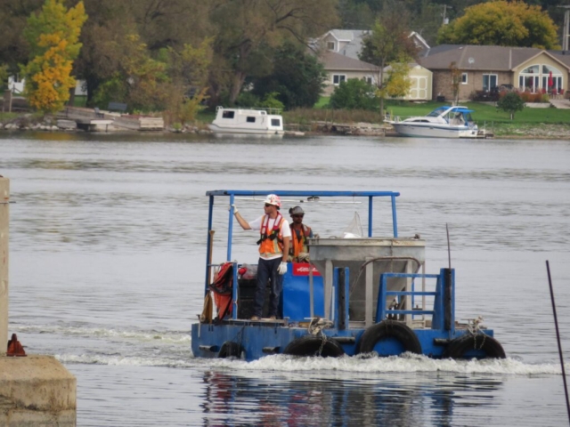 Close-up of concrete hopper on the boat, coming into the dock to be filled