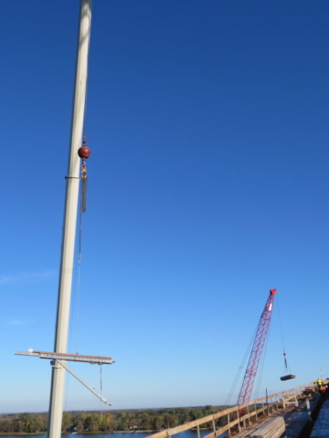 160-ton crane and 110-ton cranes lifting formwork materials and brackets