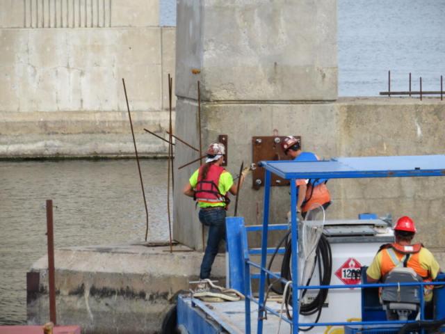 Removing the support cable plates on pier 12