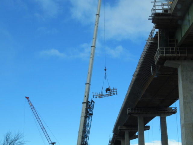 160-ton crane lifting the work bridge to the deck