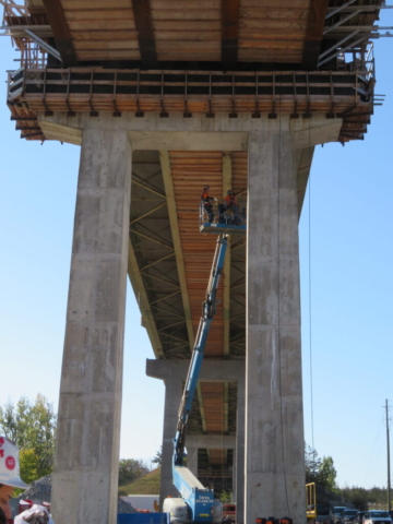 Using the Genie boom to work on the existing girders