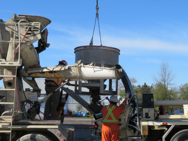 Releasing concrete from the hopper into the concrete pump truck