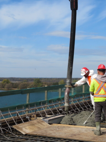 Releasing concrete from the pump truck into the deck formwork