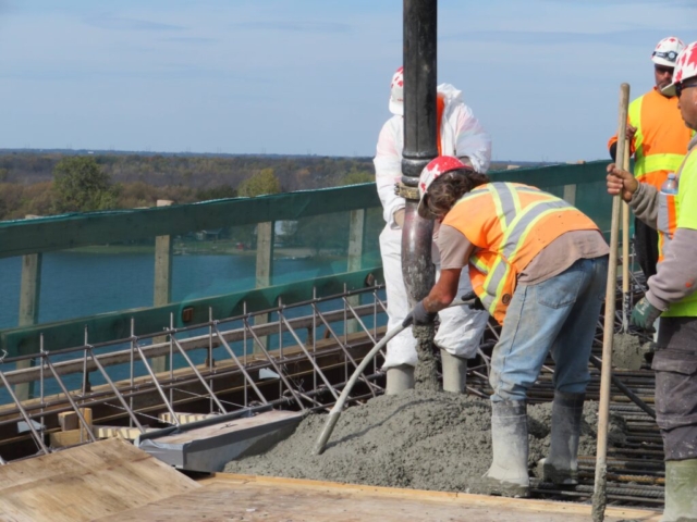 Filling and vibrating the concrete in the deck formwork