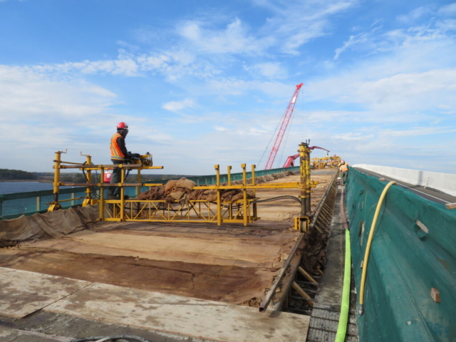 Moving the work bridge containing wet burlap