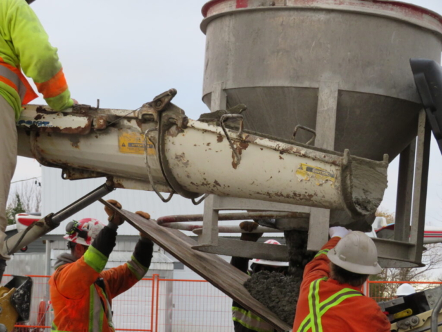 Releasing concrete from the hopper into the pump truck