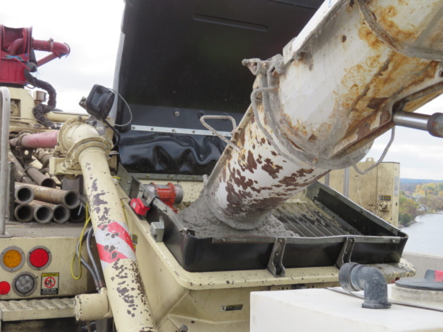 Close-up, filling the concrete pump truck