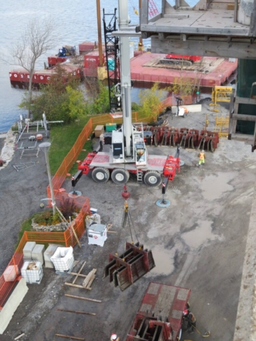 160-ton crane removing barrier wall forms from the truck