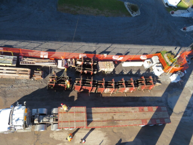 Barrier wall forms and emptied truck bed