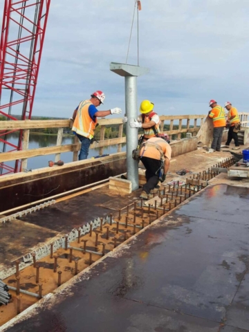 110-ton crane lowering the deck drain