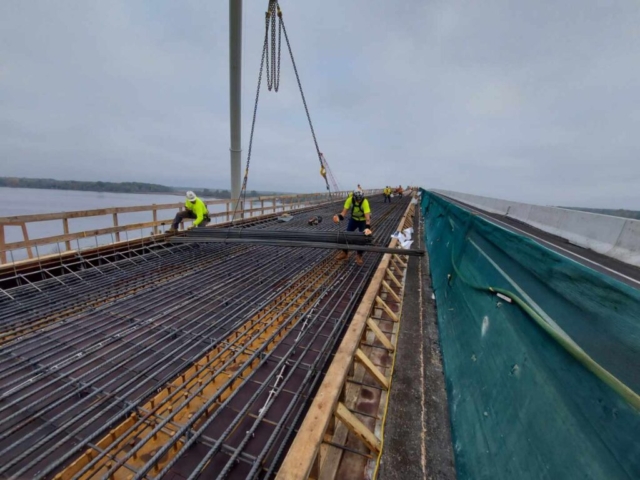 160-ton crane lowering rebar onto the deck