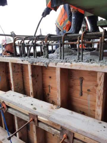 Concrete placement on pier 3, vibrating the concrete