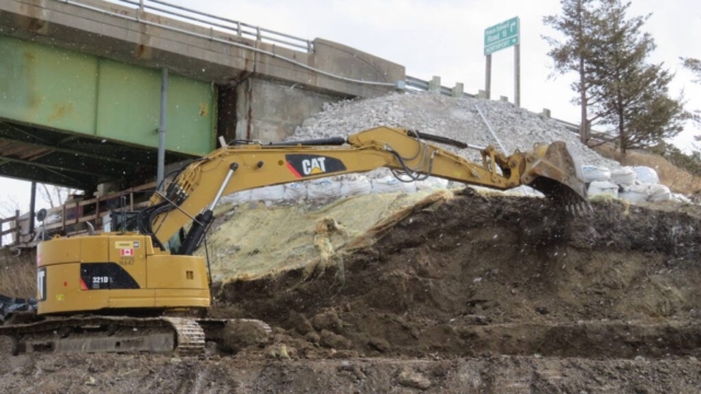 Excavator removing soil on the south abutment