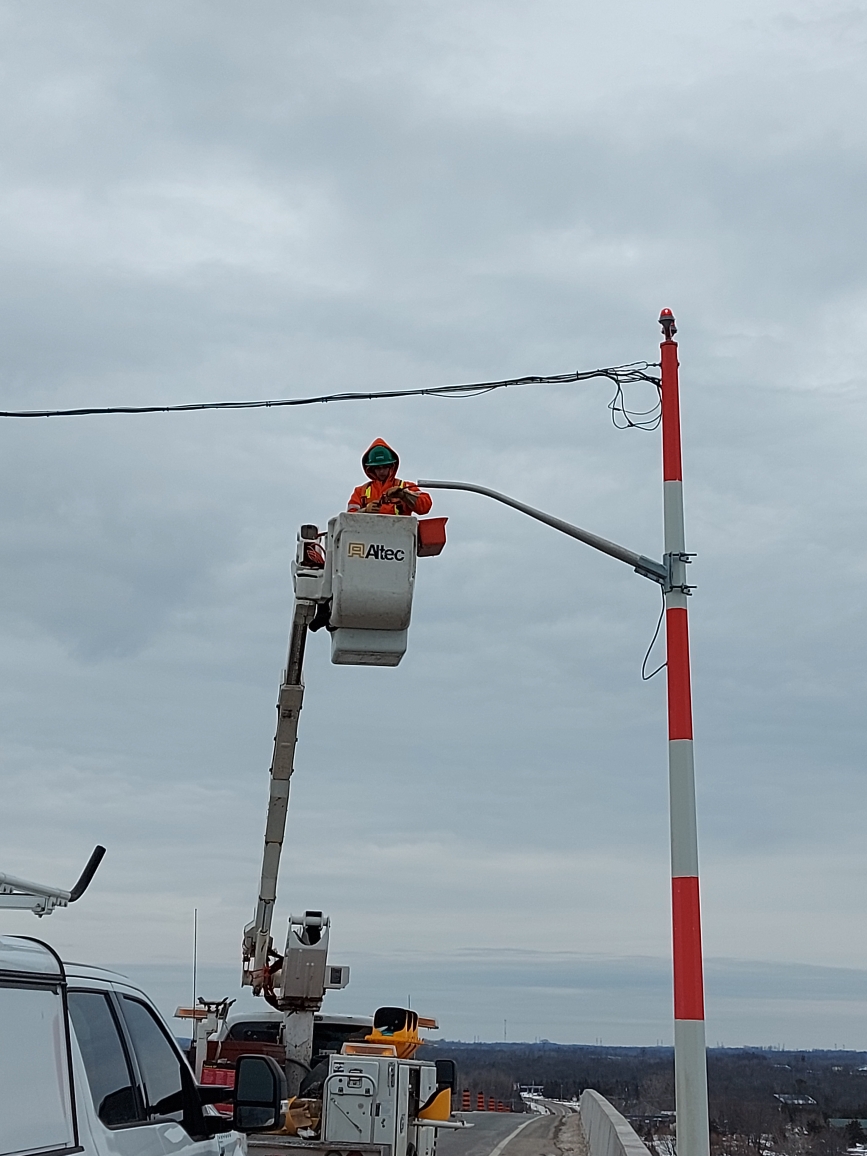Installing the traffic signal arm and hanger