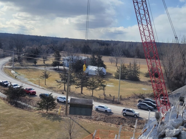 110-ton crane lowering the containment bin to be emptied