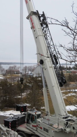 160-ton crane lifting the counter weights into place