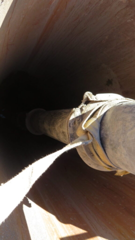 View inside caisson liner, vacuum  suction hose