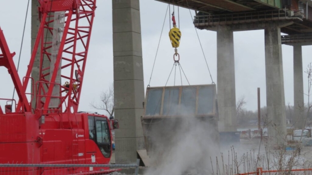 110-ton crane dumping the containment bin