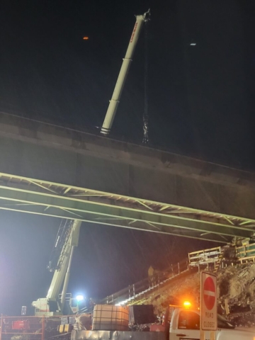 160-ton crane hooked-up to the approach girder for removal