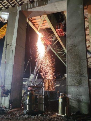 Expanded view of torch cutting the approach girder
