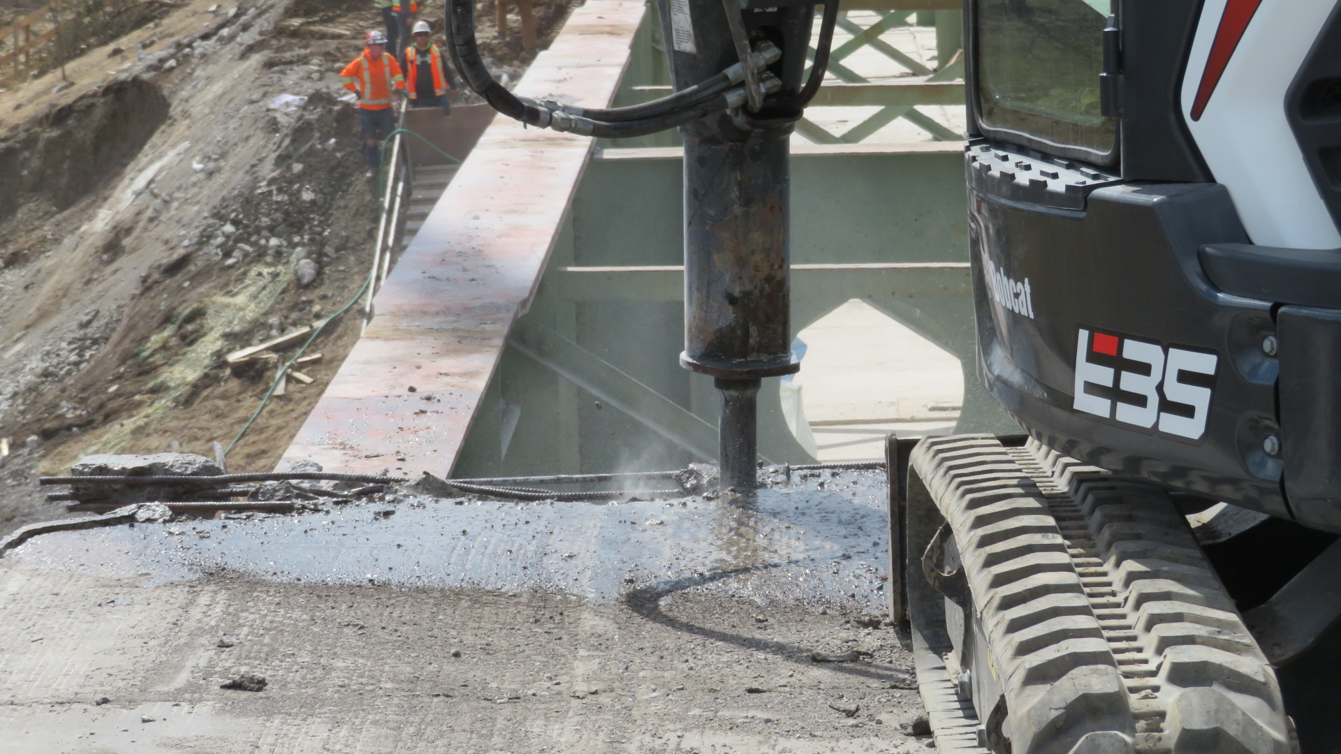 Close-up of concrete deck removal, hoe-ram