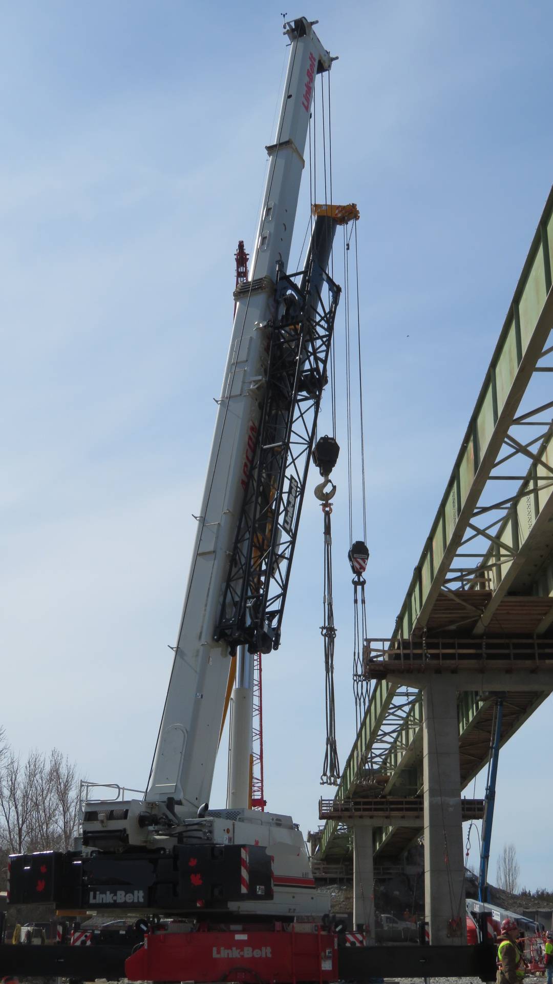 Both cranes lowering the cables for girder removal