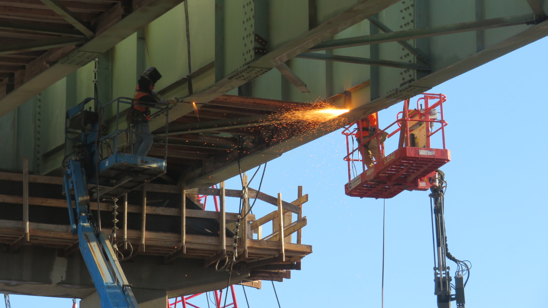 Starting to torch cut the drop-in girder for removal