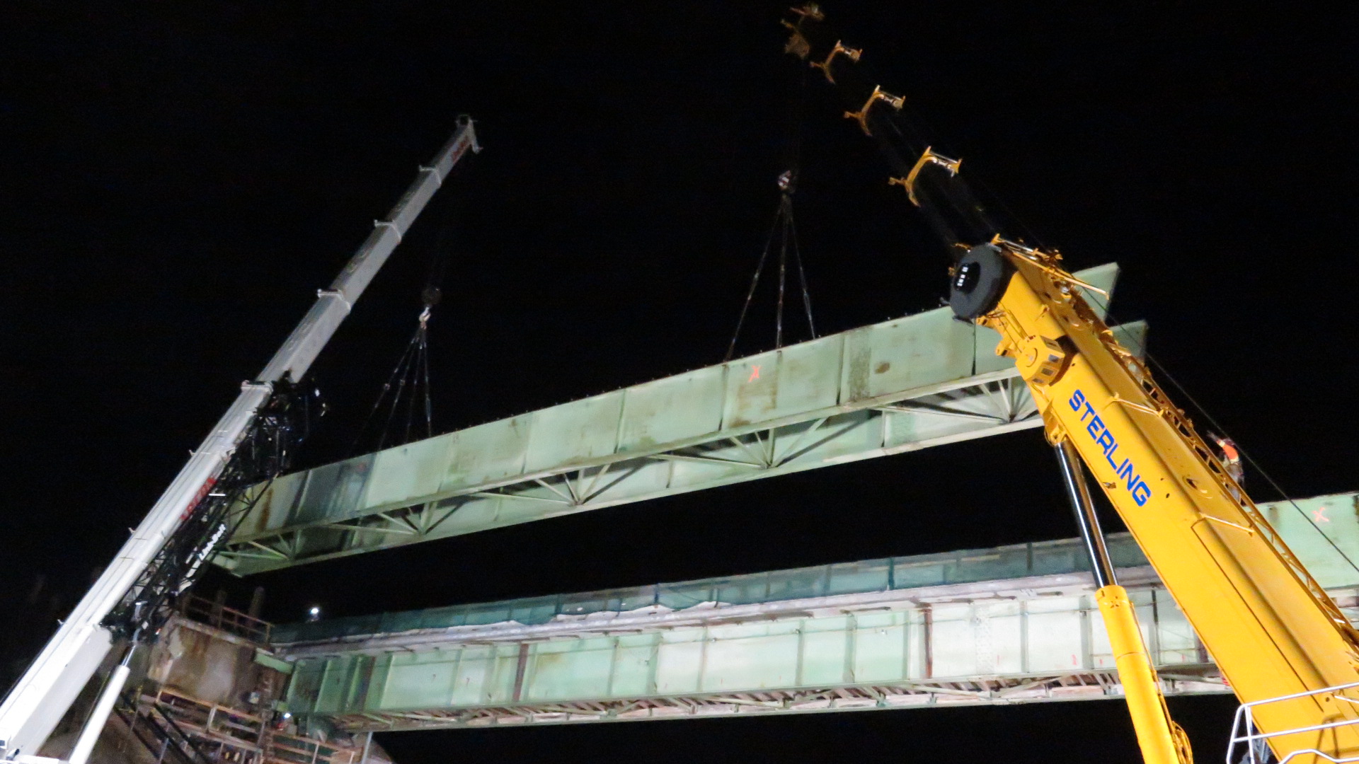 160 and 200 ton crane lowering the approach girder