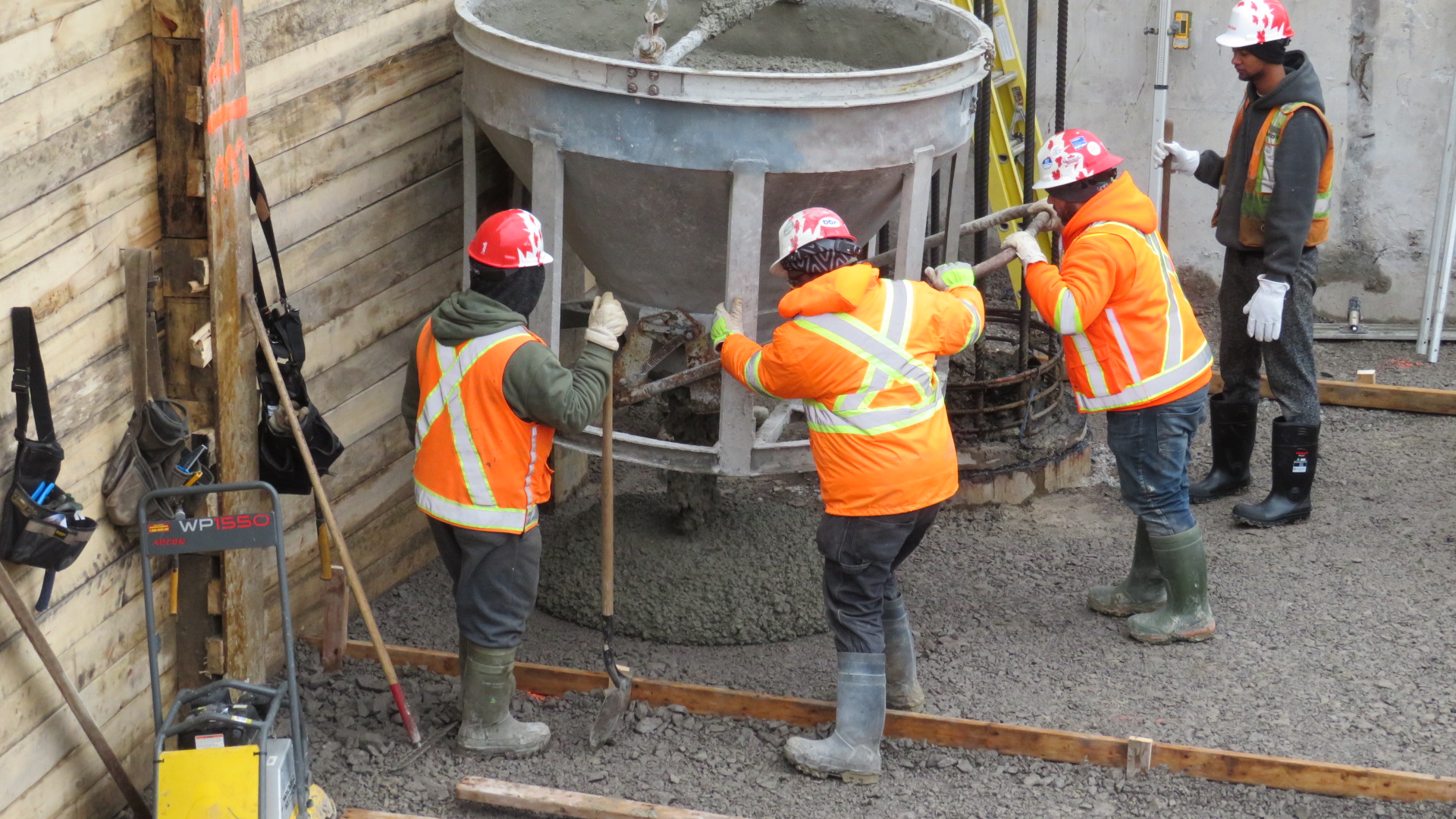 Placing concrete in the mud slab formwork