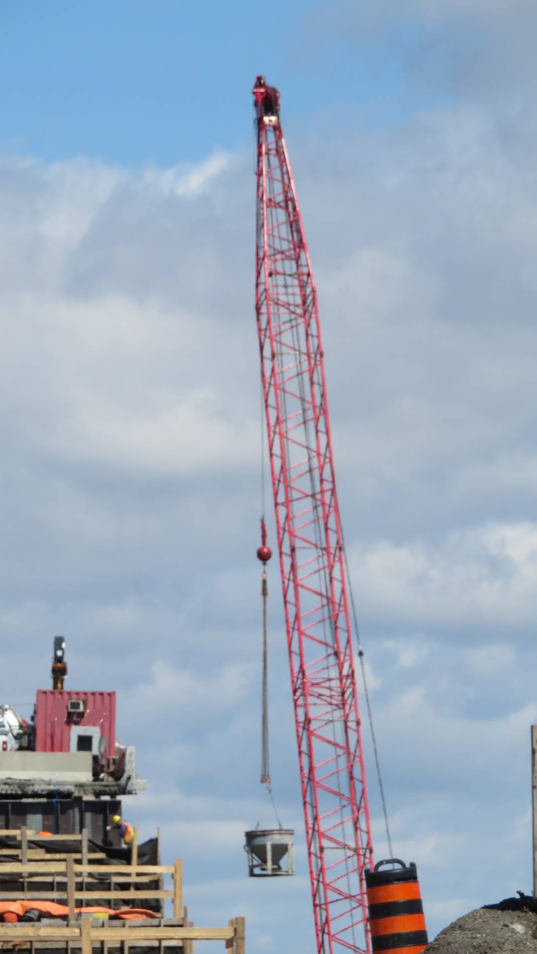 View north of 110-ton crane lifting the concrete hopper to the pier cap