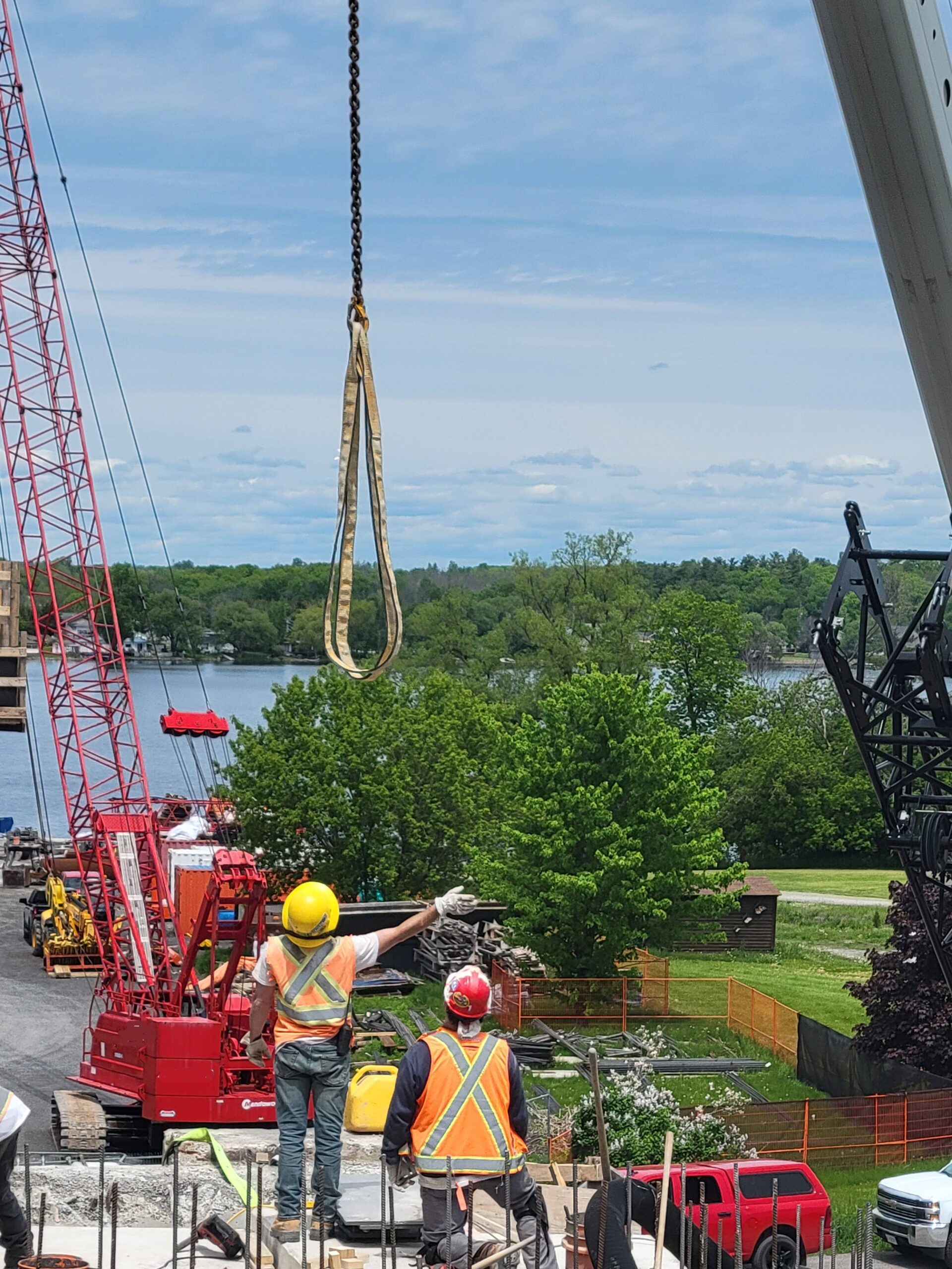 160-ton crane lowering the straps to move the bearing seats