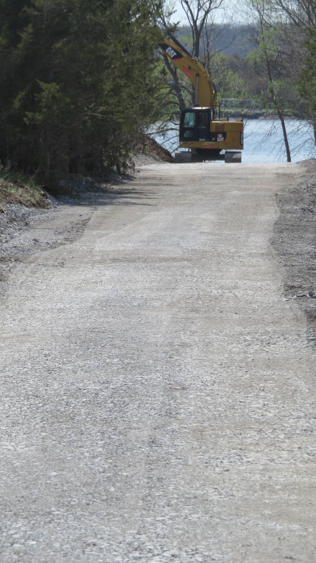 Access road construction, excavator