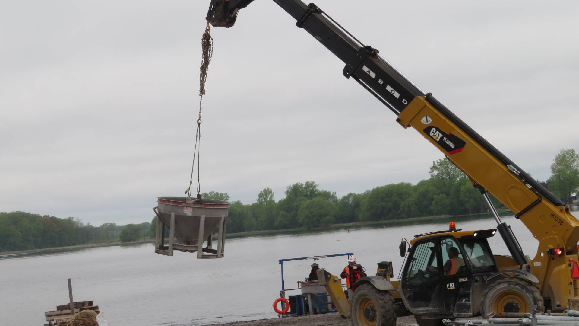 Removing the empty concrete hopper from the boat