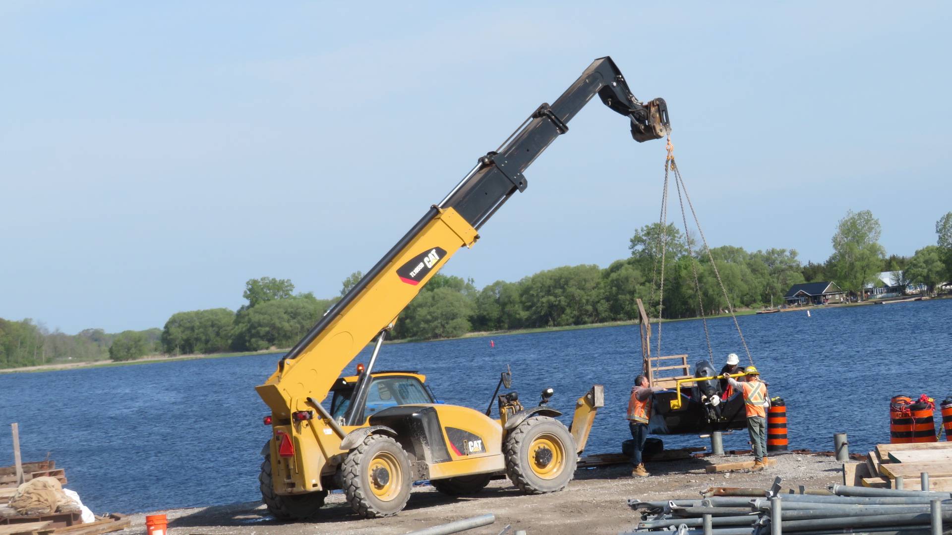 Using the telehandler to remove the boat from the water