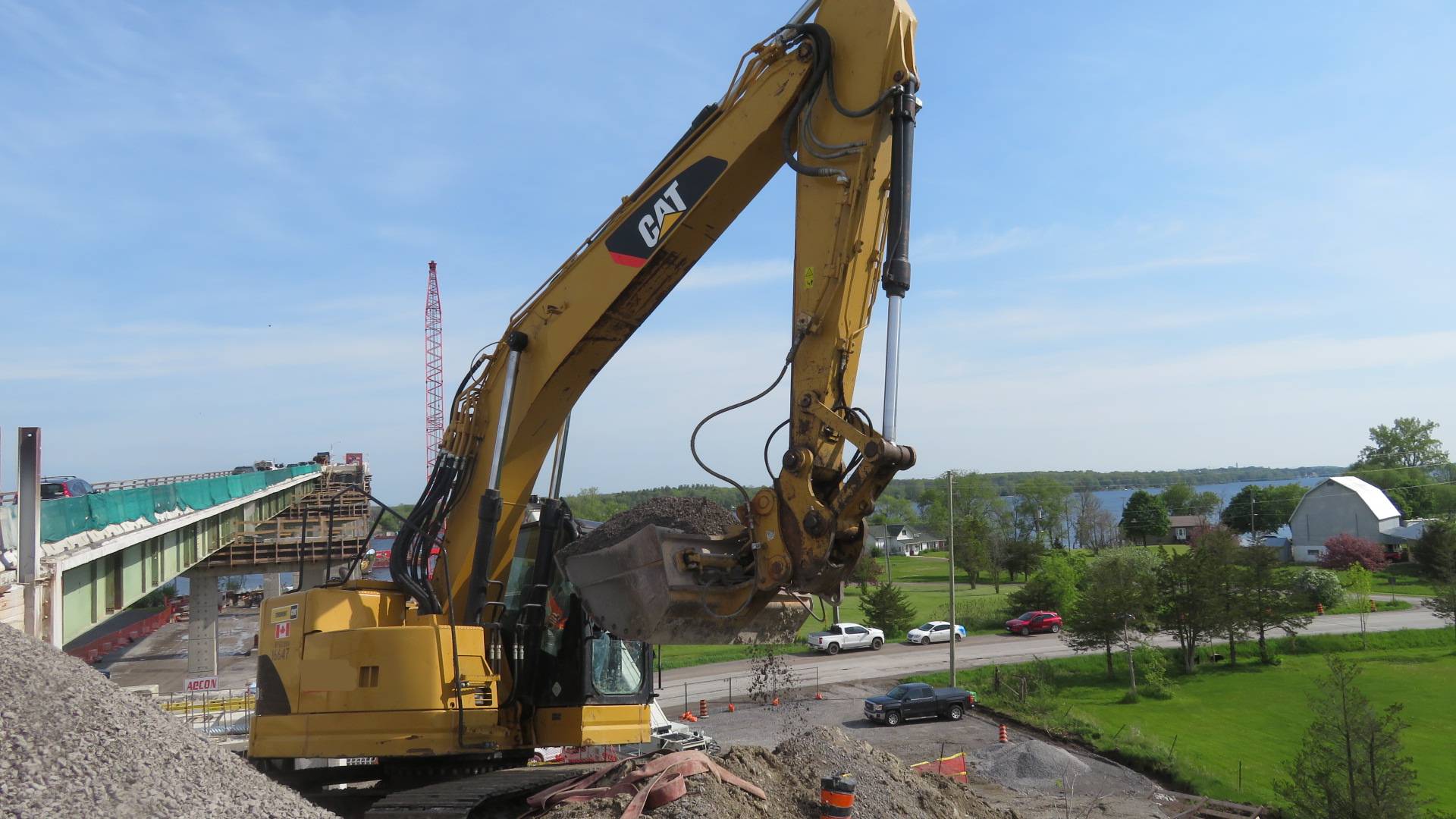 Excavator moving the granular for placement