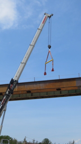 160-ton crane removing the spreader bar from the girder