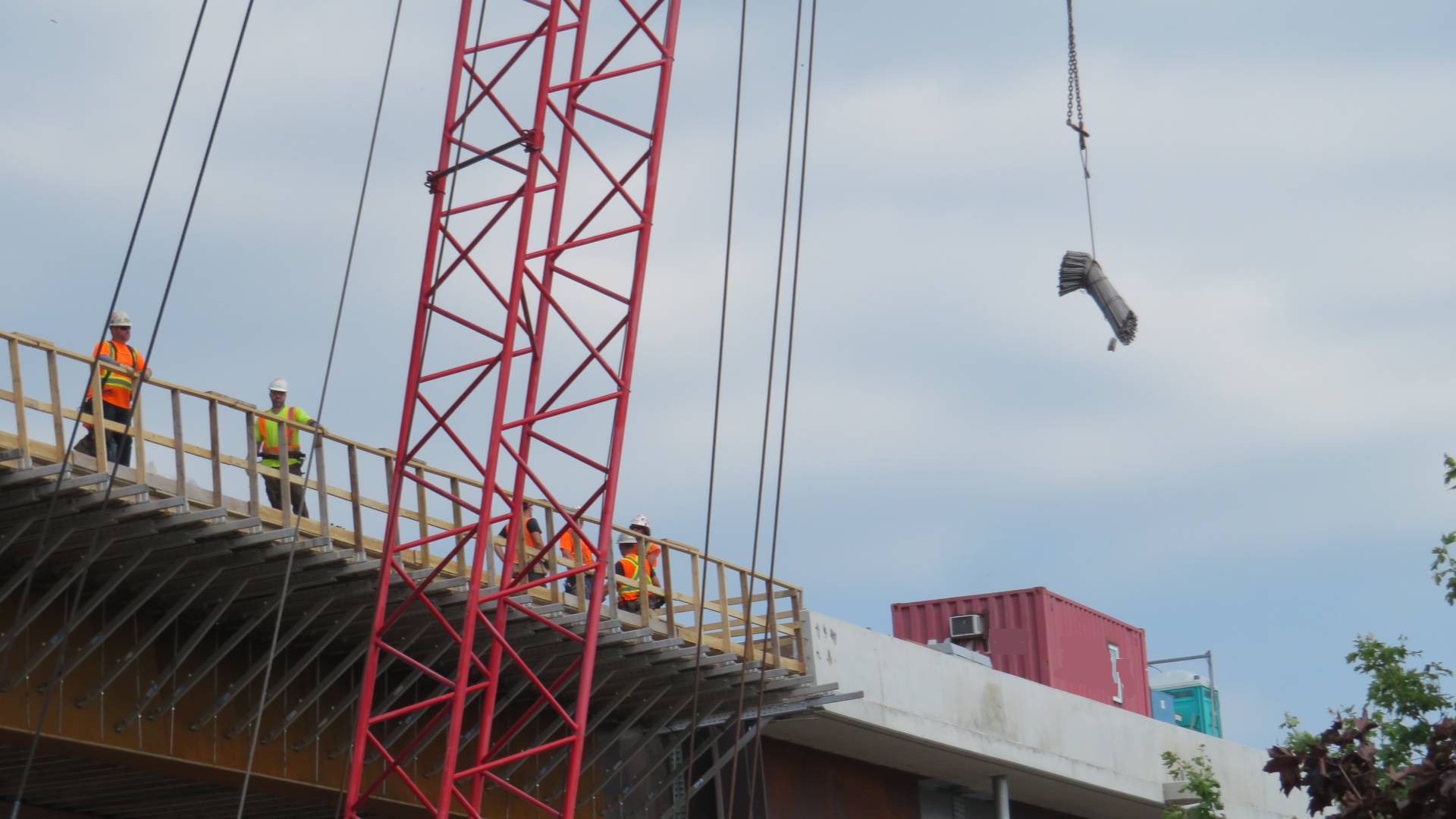 110-ton crane lifting the rebar to the deck