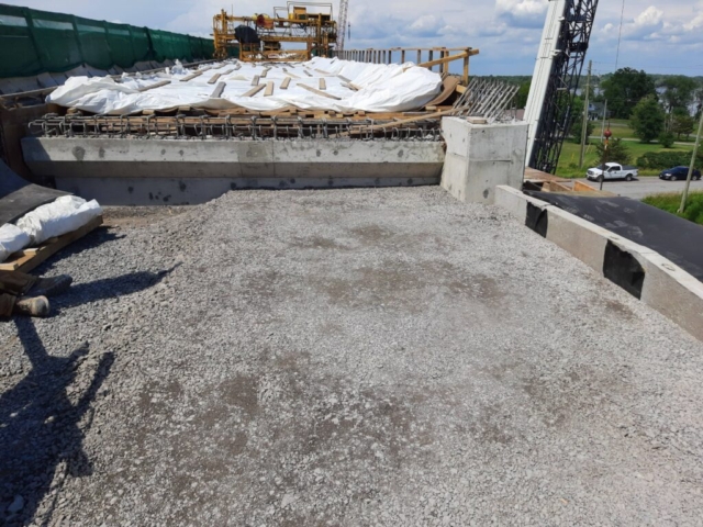 South abutment granular, north view deck after first concrete placement