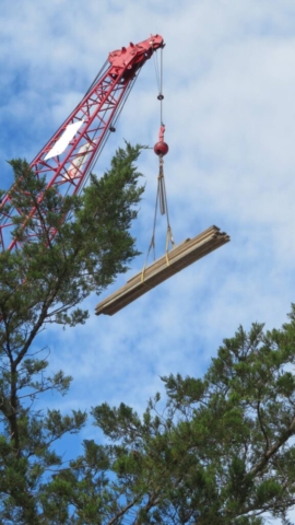 110-ton crane lowering materials to the deck for formwork