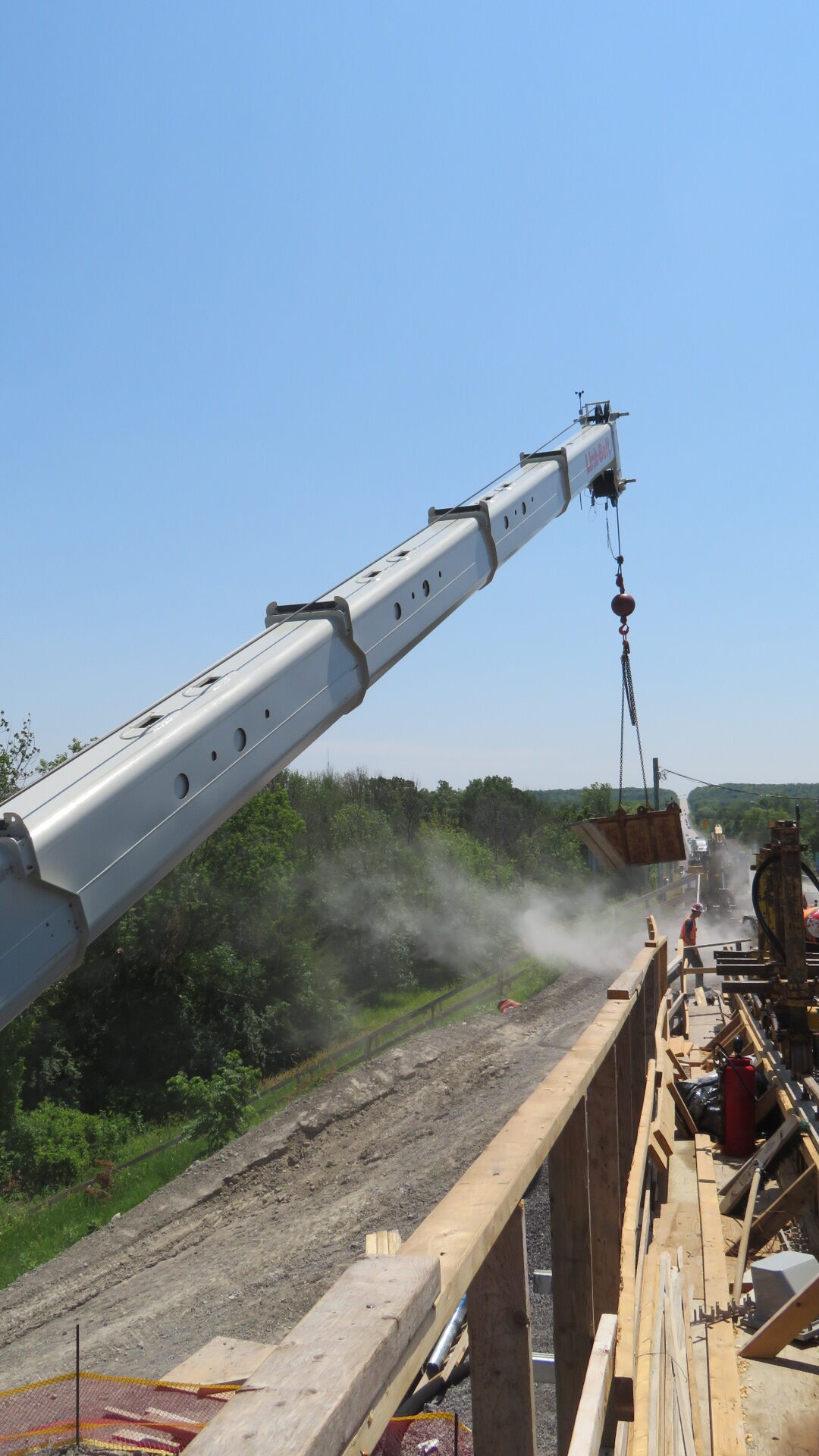 160-ton crane starting to lift the debris bin