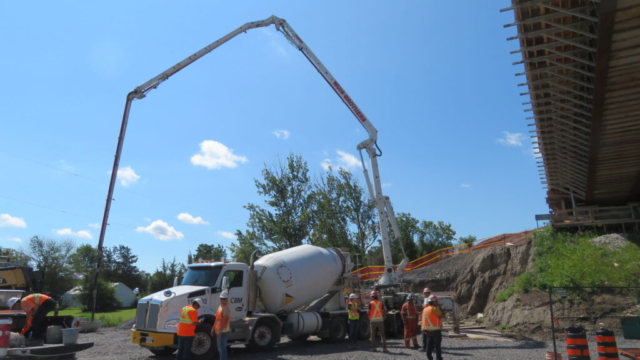 Concrete truck backing in for concrete placement