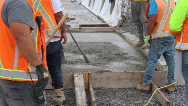Vibrating the concrete approach slab