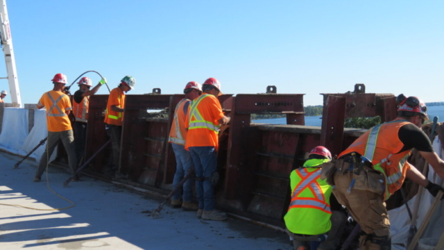 Placing the second section of the barrier wall