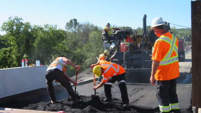Placing asphalt for south approach ramping