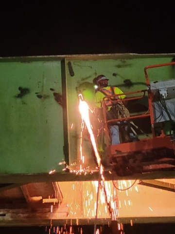Torch cutting both sides of the approach girder