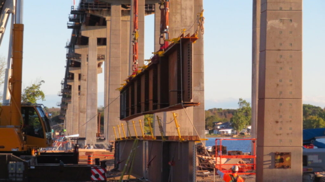 Close-up, starting to lift the first girder