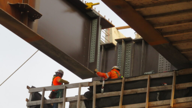 Lowering the girder into place